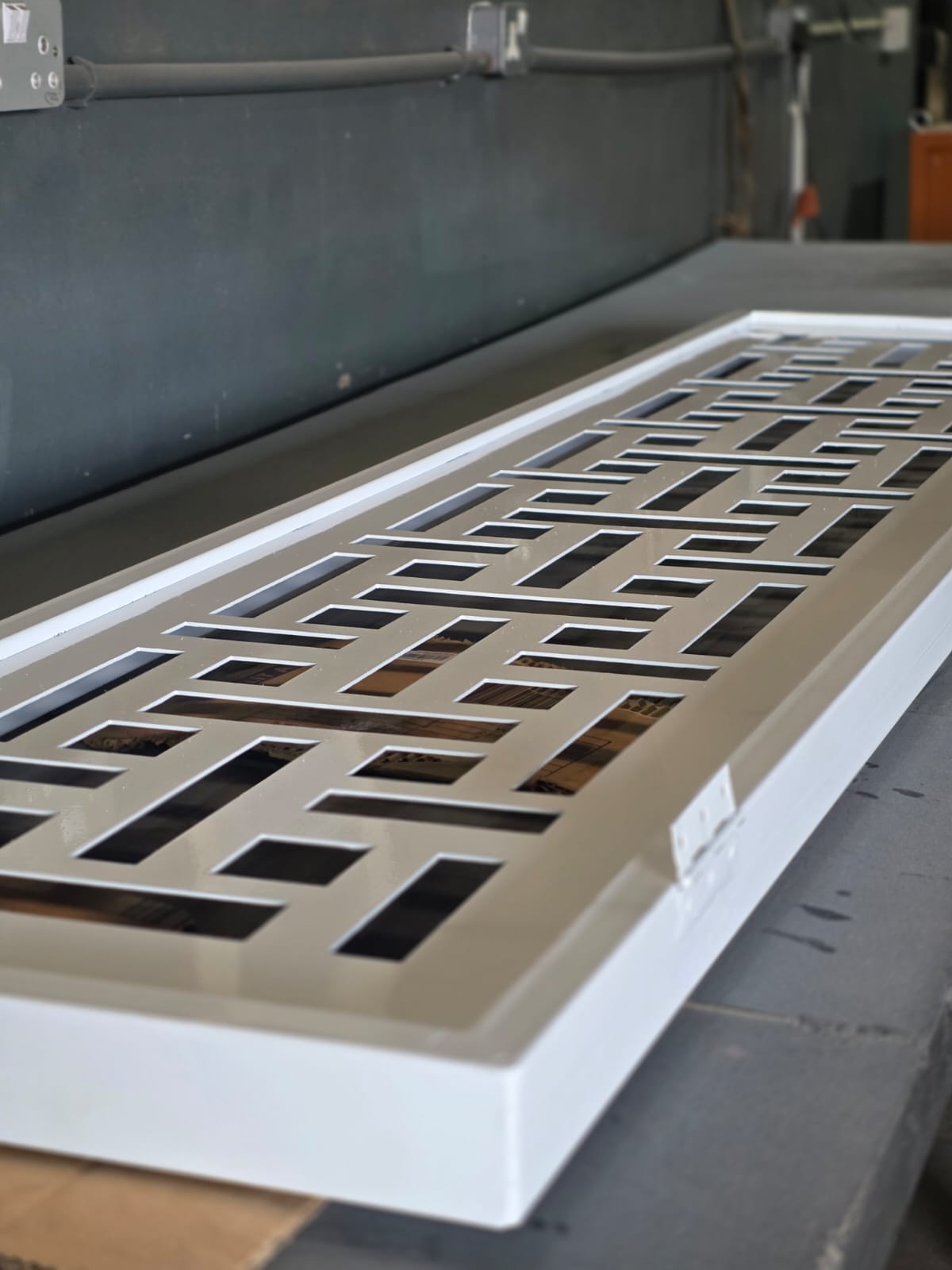 White powder-coated geometric lattice steel panel